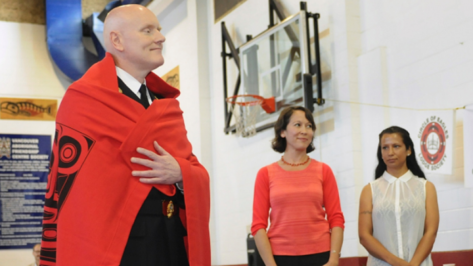 Vancouver Police Chief Adam Palmer being blanketed in 2015 at a ceremony at Vancouver’s Aboriginal Friendship Centre. 