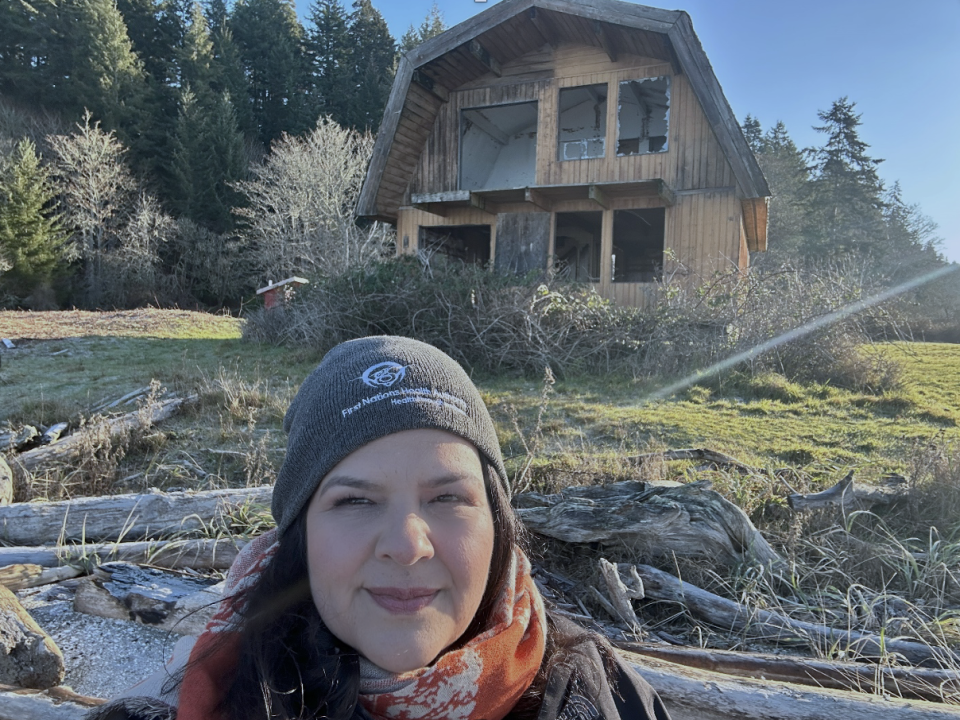 Hereditary Chief Shana Thomas by one of the last houses on the Leey'qsun Island Reserve.